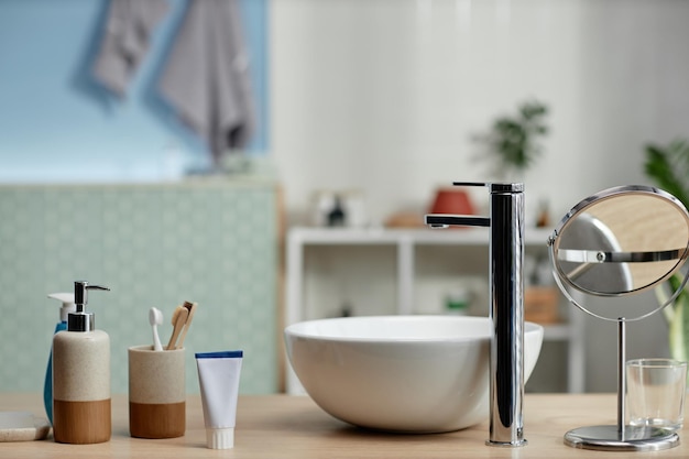 Bathroom Chrome Faucet and Sink on Vanity Table with Zero Waste Accessories