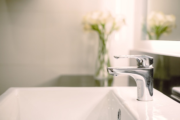 Bathroom interior luxury sink and faucet in toilet for washing hand with flower decoration