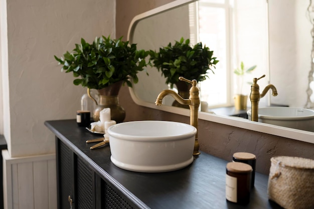 Bathroom interior sink on wooden countertop