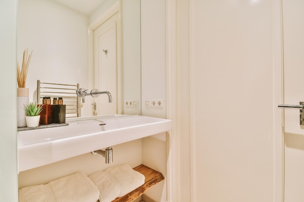 Bathroom interior with a large sink and bathroom accessories in a modern house