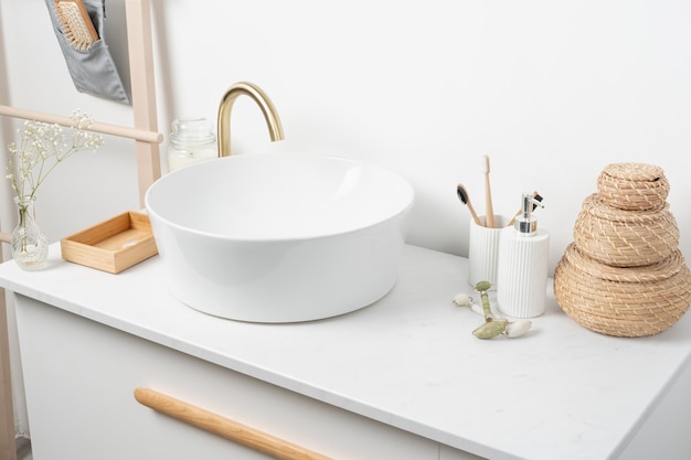 Photo bathroom marble counter with sink candles and toothbrushes near white wall copy space