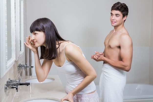 Bathroom routine for happy young couple