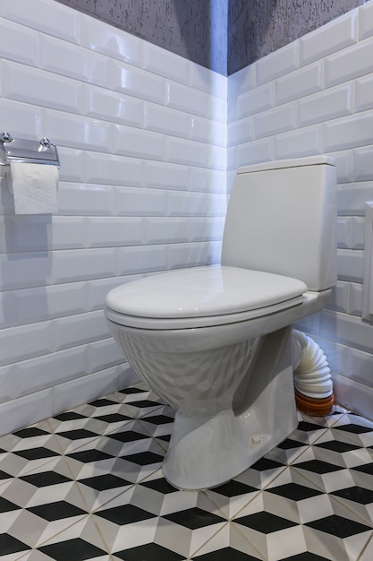 Bathroom white toilet with tiles