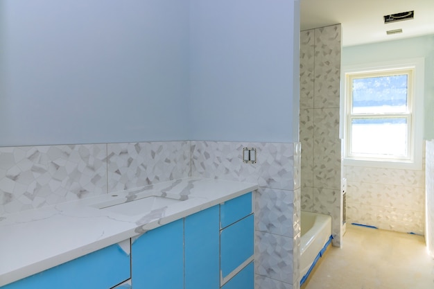 Bathroom with marble sink and shower curtain.