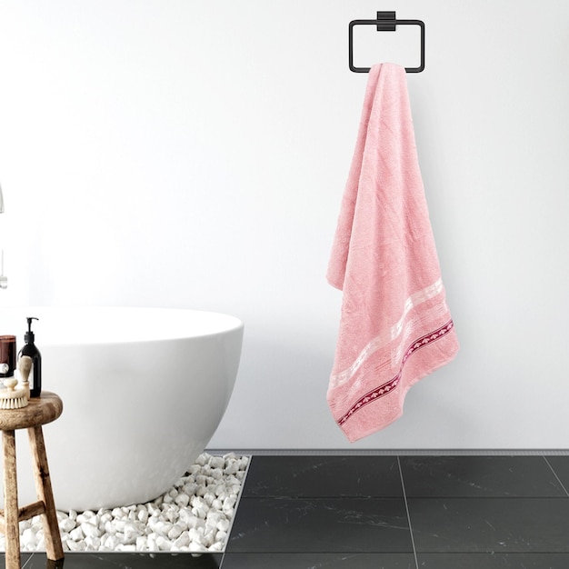 A bathroom with a pink towel hanging from a hook
