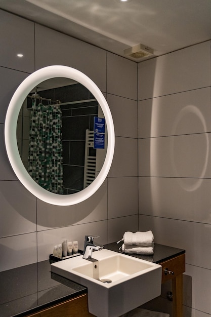bathroom with round mirror