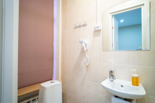 A bathroom with a shower and a sink