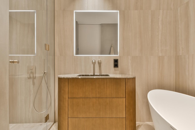 a bathroom with a sink and mirror and a shower