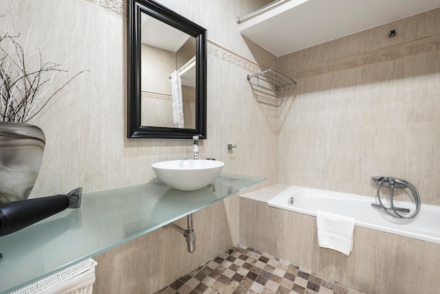 A bathroom with a sink, tub, and mirror that says'bathtub '