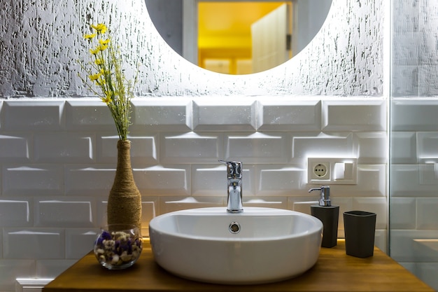 Bathroom with white tiles in a modern small apartment