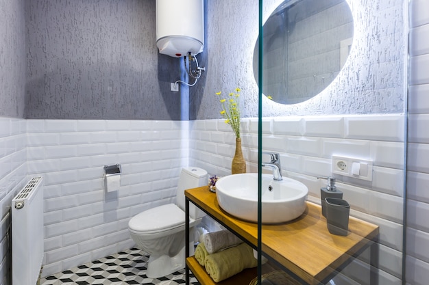 Bathroom with white tiles in a modern small apartment