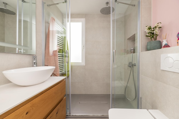 Bathroom with wooden furniture with designer sink