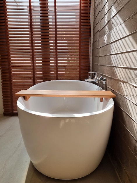 The bathtub in the bathroom of the beach resort for relaxing on holiday