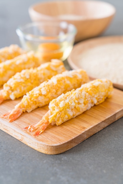 batter-fried prawns on wood board