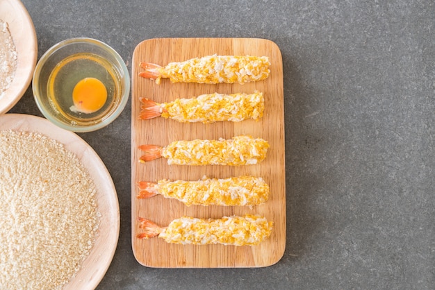 batter-fried prawns on wood board