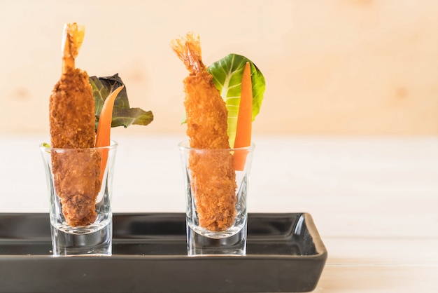  batter-fried prawns on wood