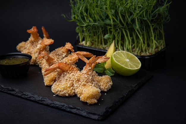 battered shrimp on a dark background