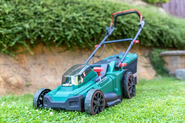 Photo battery electric lawn mowers in the garden