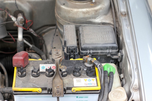 battery and fuse box in the old car engine room