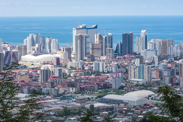 BATUMI GEIRGIA SEPTEMBER 2021 ariel panoramic view of old city and skyscrapers with the sea from the mountains