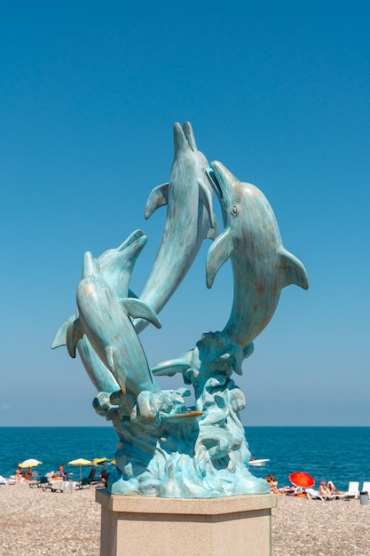 Batumi Georgia 30 August 2022 Dolphin statue on the coast of Batumi