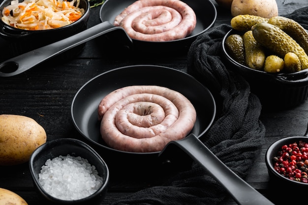 Bavarian sausage mashed potatoes and sour cabbage in cast iron frying pan