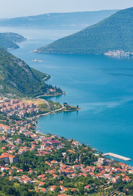 Bay of Kotor summer misty view from up and Kotor town on coast (Montenegro)