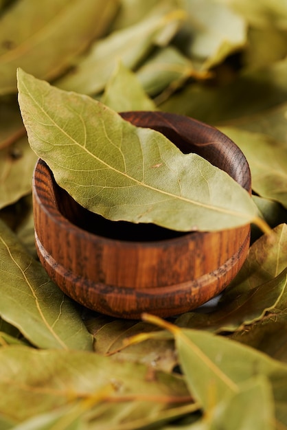 Bay leaves in a wooden bowl
