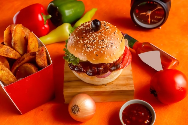 Bbq chicken cheese burger with french fries potato and tomato\
slice isolated on wooden board side view on table fast food