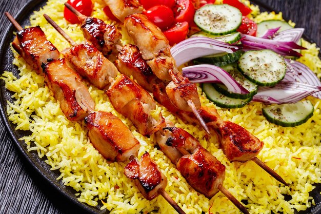 Bbq chicken kebabs with saffron rice and veggies