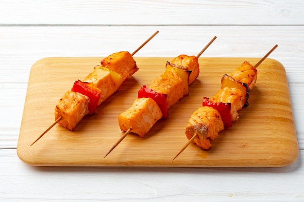 Bbq kebabs on the skewers served on wooden board