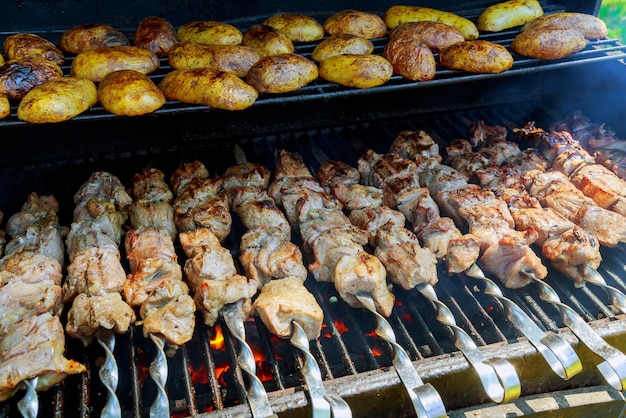 BBQ meat and potato on grill