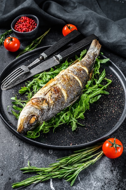 BBQ sea Bass fish with arugula, fried sea bass