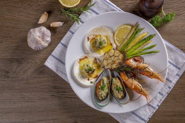 BBQ seafood and vegetables on the chopping board