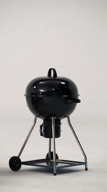 BBQ stove that made from black color steel for party or family picnic and on white background studio.