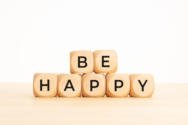 Be Happy phrase on wooden blocks. Copy space