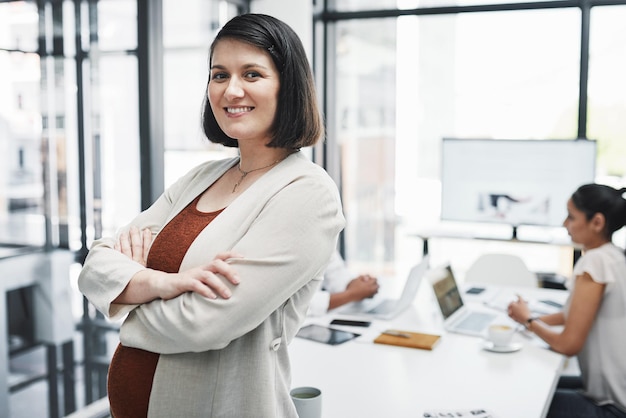 Be the kind of leader worth following Portrait of a confident pregnant businesswoman having a team meeting in a modern office