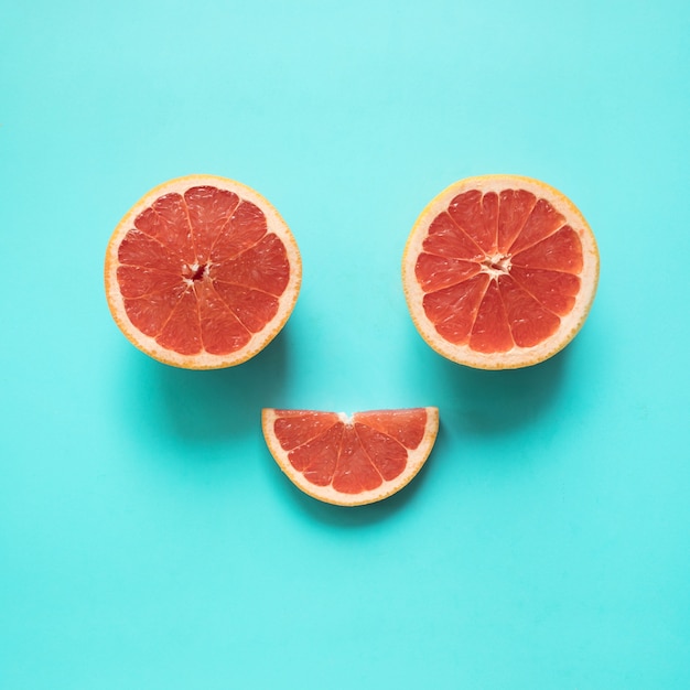 Be smile flat lay with red orange food on blue