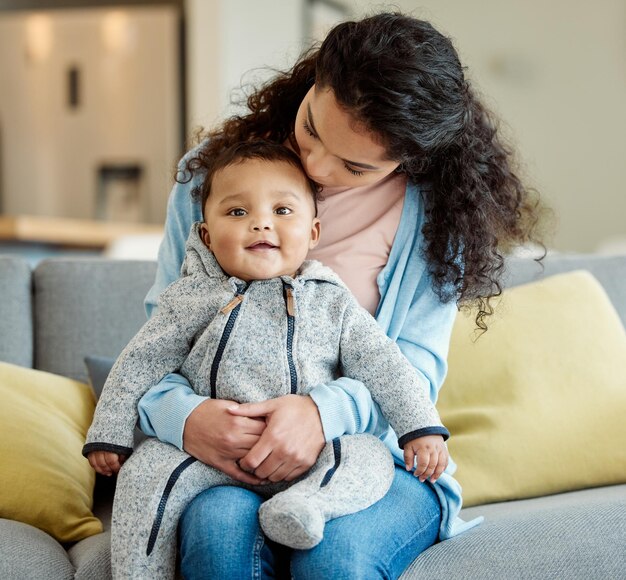 To be so complete Shot of a young mother bonding with her baby boy on the sofa at home