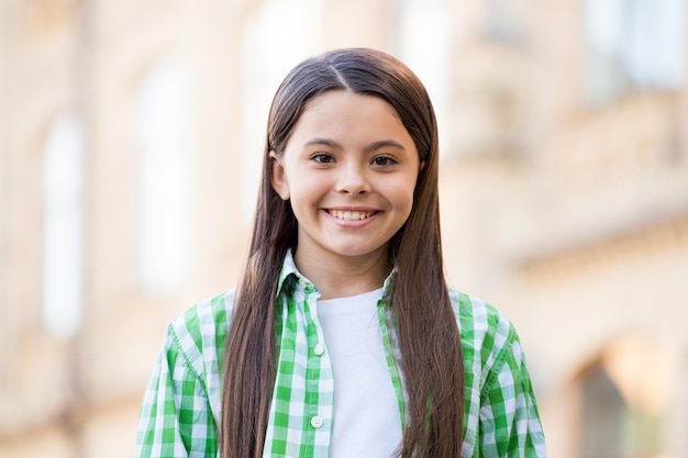 Be you every day. Happy kid smile outdoors. Beauty look of little girl. Beauty salon. Skincare cosmetics. Haircare products. Beauty is all about you.