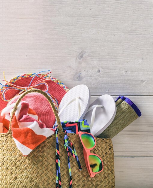 Beach accessories in a bag Summer holiday concept