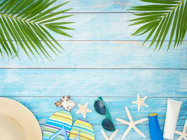 Photo beach accessories with palm leaves.