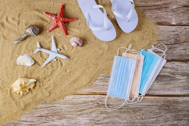 Beach accessories with sand and a protective mask