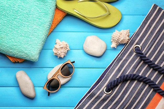 Beach accessories on wooden background Vacation concept