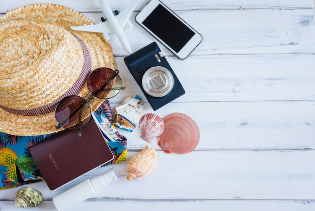 Beach accessories on wooden and copy space.