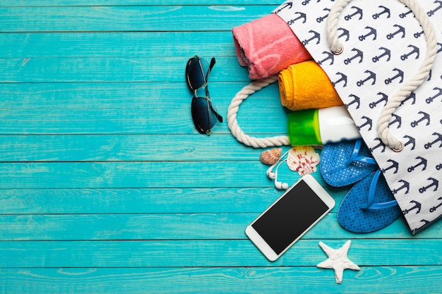 Beach accessories on wooden table