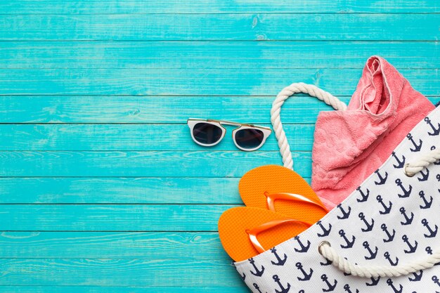 Beach accessories on wooden table.