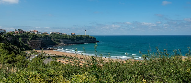 Beach of Anglet with the ligthouse of Biarritz 