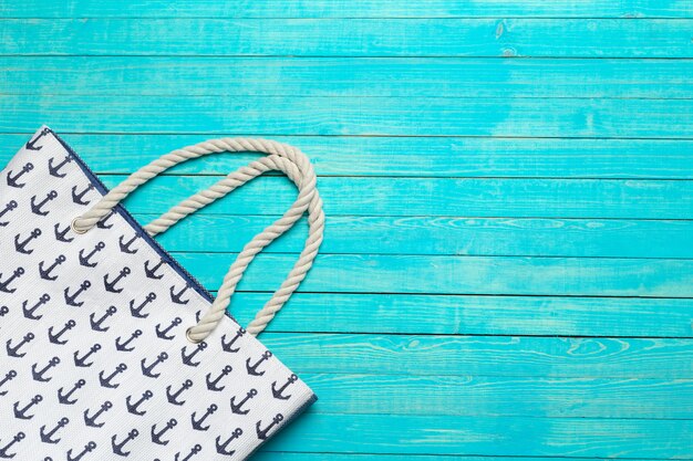 Beach bag on wooden surface