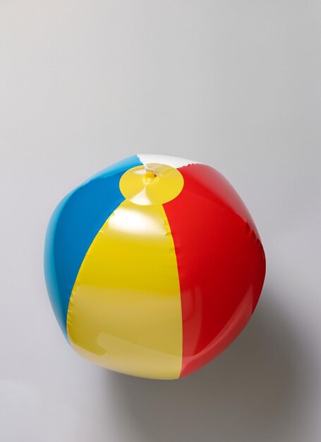 Photo beach ball on flat lay white background generative ai